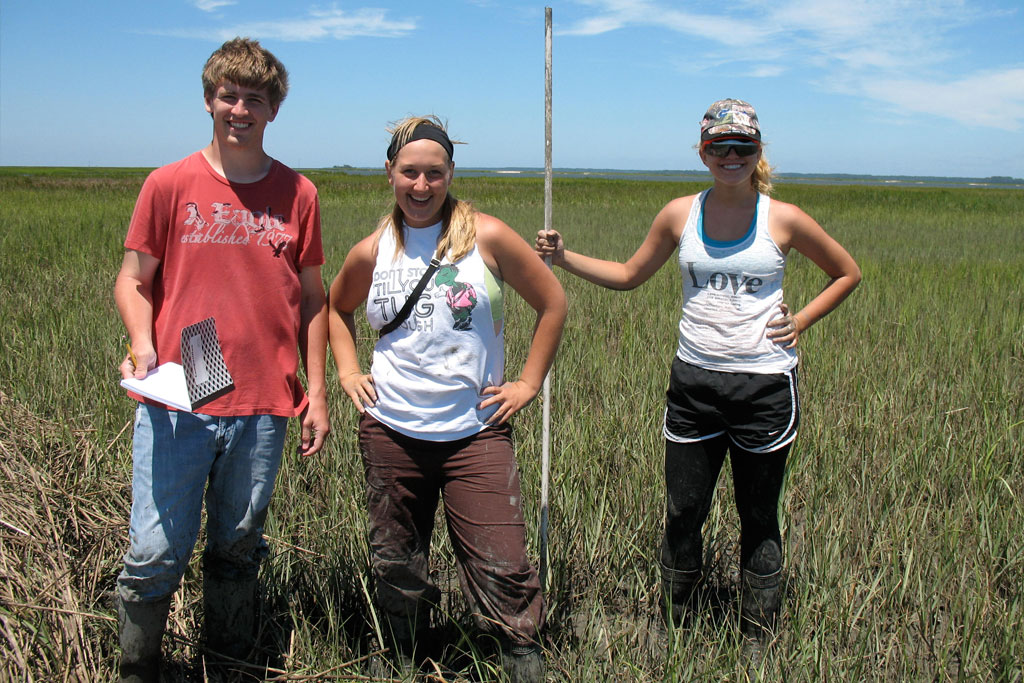 Creighton students in the marsh